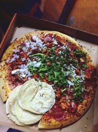High angle view of pizza served in plate