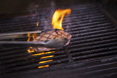 Close-up of meat on barbecue grill