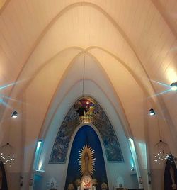 Low angle view of illuminated ceiling