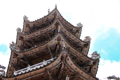 Low angle view of temple building against sky