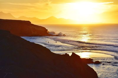 Scenic view of sea against sky during sunset