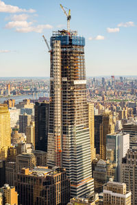 Modern buildings in city against sky