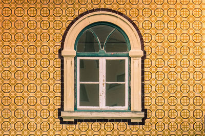 Low angle view of window on old building