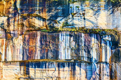 Full frame shot of rocks with reflection in water