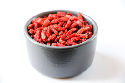 Close-up of strawberries in bowl against white background