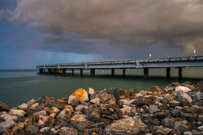 Bridge over sea against sky