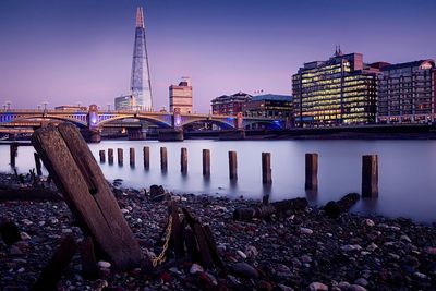 Thames river by the shard against sky at dusk