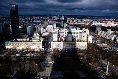 High angle view of illuminated city buildings against sky