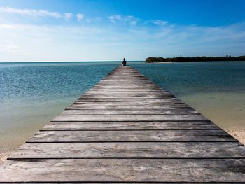 Pier over sea against sky