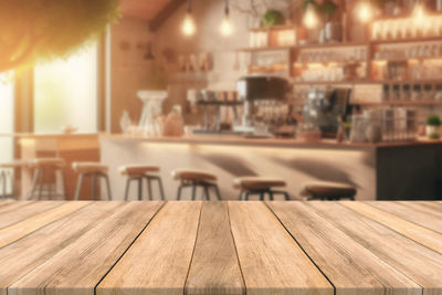 Close-up of wooden table at restaurant