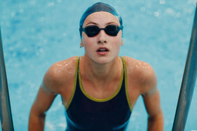 Portrait of man swimming in pool