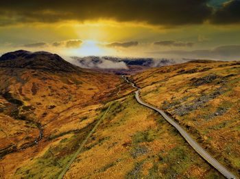 Scenic view of landscape against sky during sunset