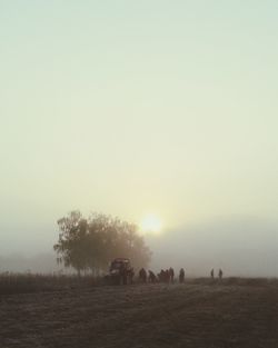 Scenic view of landscape against sky at sunset