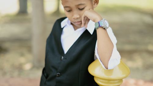 Close-up of girl holding camera