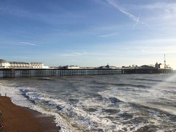 Scenic view of beach against sky in city