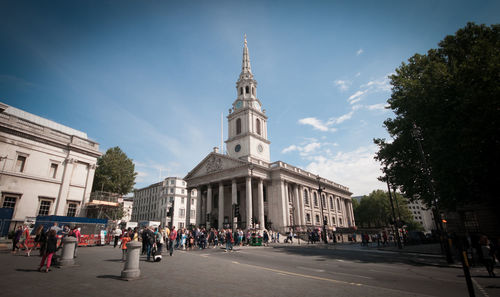 People at st martin-in-the-fields against sky