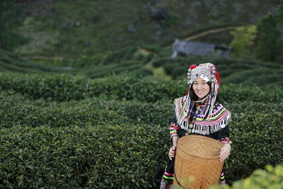 Full length of woman standing on field