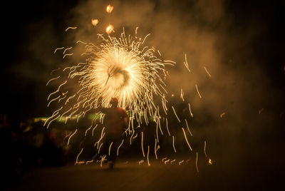 Firework display at night