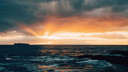 Scenic view of sea against sky during sunset