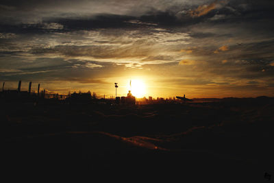 Scenic view of landscape at sunset