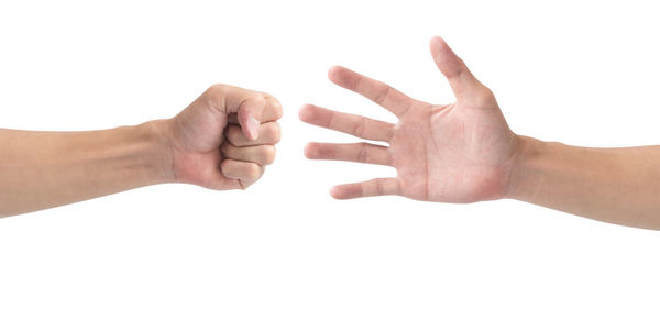 Close-up of human hand against white background