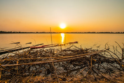 Scenic view of lake against sky during sunset