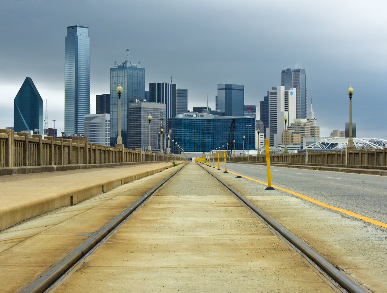 architecture, building exterior, built structure, city, skyscraper, clear sky, tall - high, long, modern, tower, urban skyline, the way forward, tall, surface level, engineering, narrow, office building, day, outdoors, building story, blue, sky, city life, financial district, no people