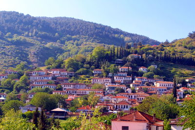 Buildings in town against sky