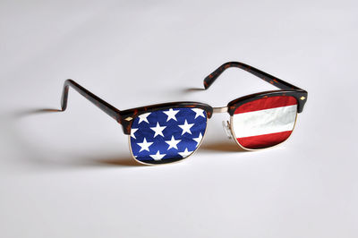 Close-up of sunglasses against white background