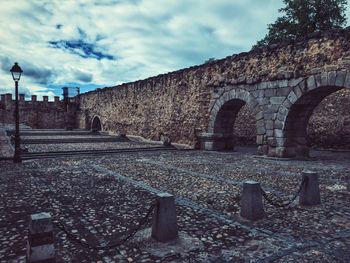 Built structure against cloudy sky