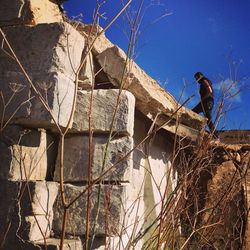 Low angle view of built structure against blue sky