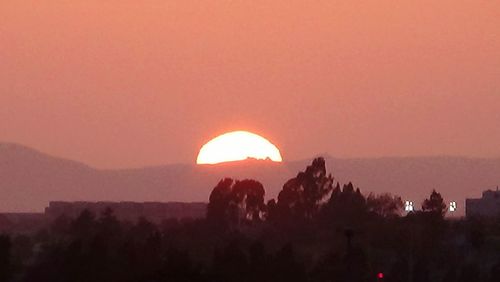 Scenic view of landscape against sky during sunset