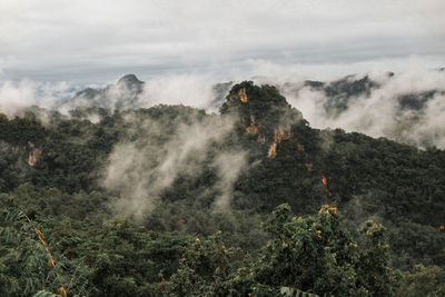 Scenic view of waterfall against sky