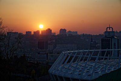 High angle view of buildings against sky during sunset