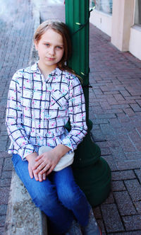 Portrait of smiling girl on purple outdoors