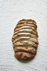 High angle view of bread on table against white background