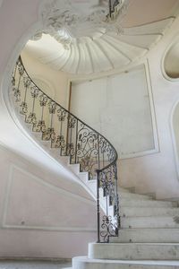 Low angle view of spiral staircase in building