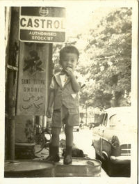 Full length of boy standing in bus