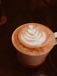 Close-up of cappuccino on table
