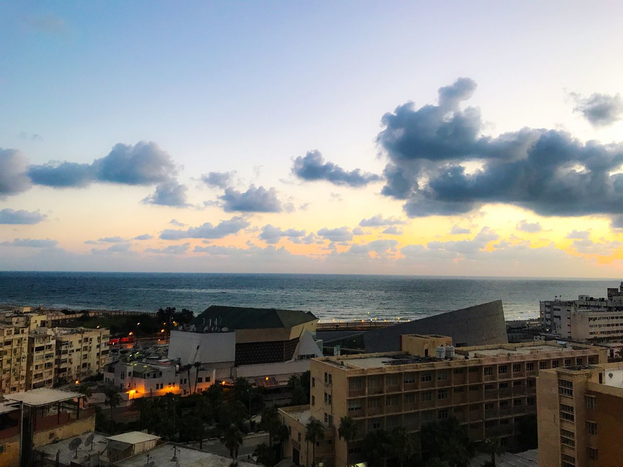 CITYSCAPE BY SEA AGAINST SKY