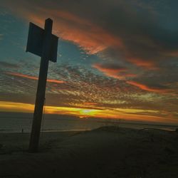 Scenic view of sea against orange sky