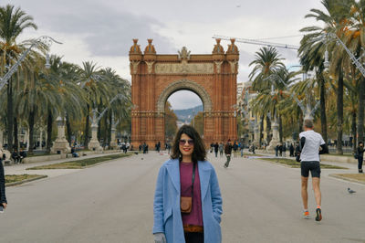 Full length of woman in front of building