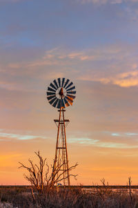 Sunrise sky and windmill in west texas