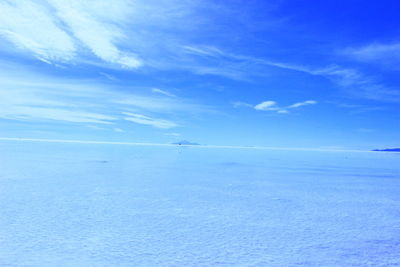 Scenic view of sea against blue sky