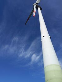 Low angle view of crane against sky