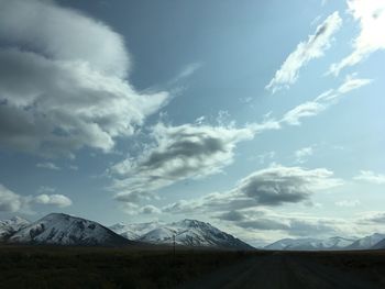 Scenic view of snowcapped mountains against sky