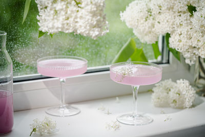 Close-up of wineglasses on table