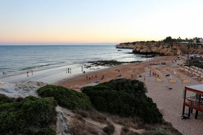 Scenic view of sea against clear sky during sunset