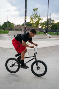 Man riding bicycle on street