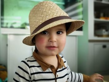 Portrait of cute boy wearing hat